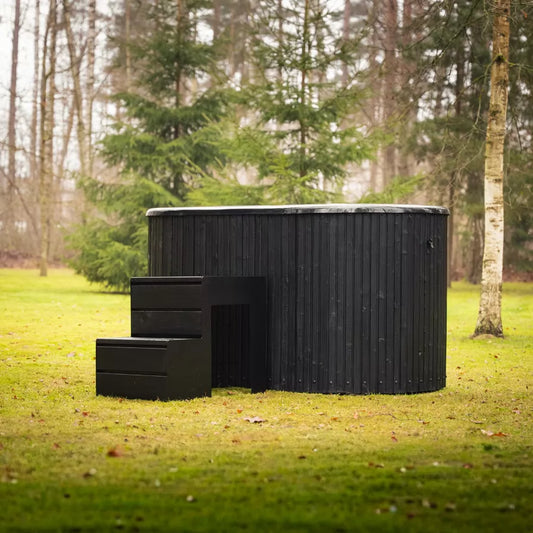 Heritage Sauna® Lux Artico Architectural cold plunge in a wooded backyard