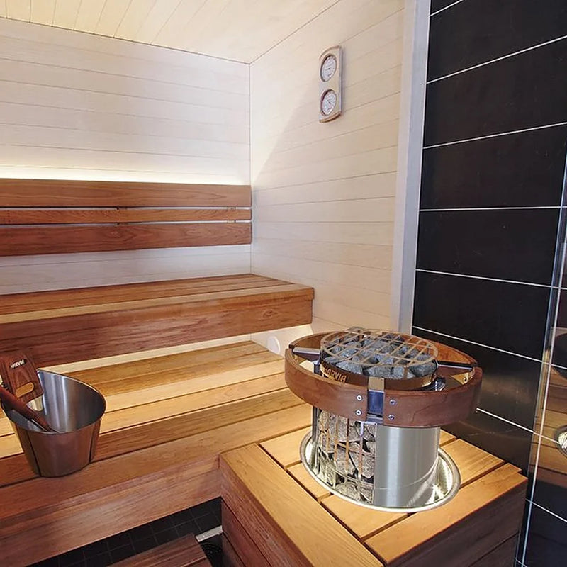 Load image into Gallery viewer, Harvia Cilindro 11kW 3-phase heater installed in a sauna room with railings