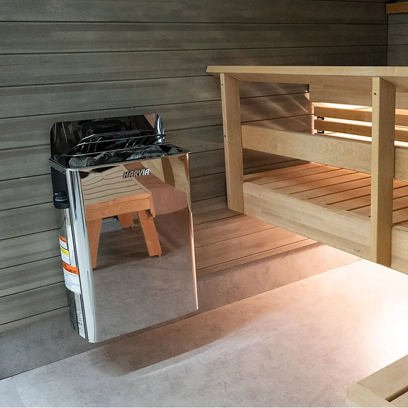 Load image into Gallery viewer, Harvia The Wall SW stainless heater beside wooden sauna benches