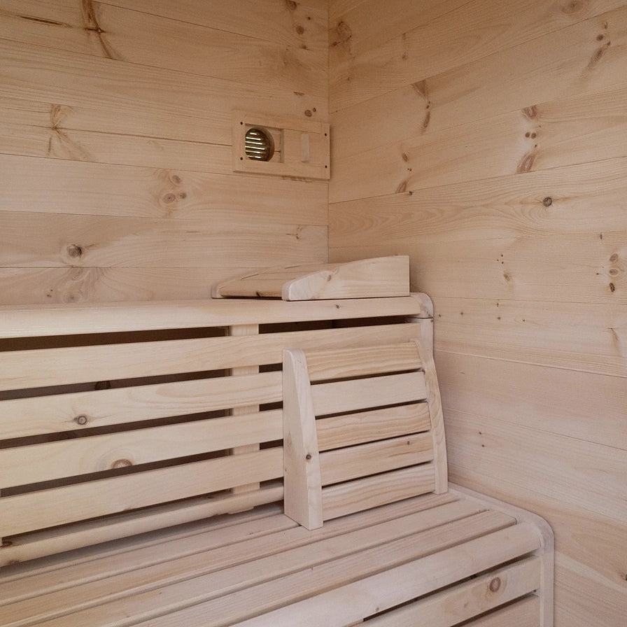 4-person cabin sauna interior with wood benches, vent and heater