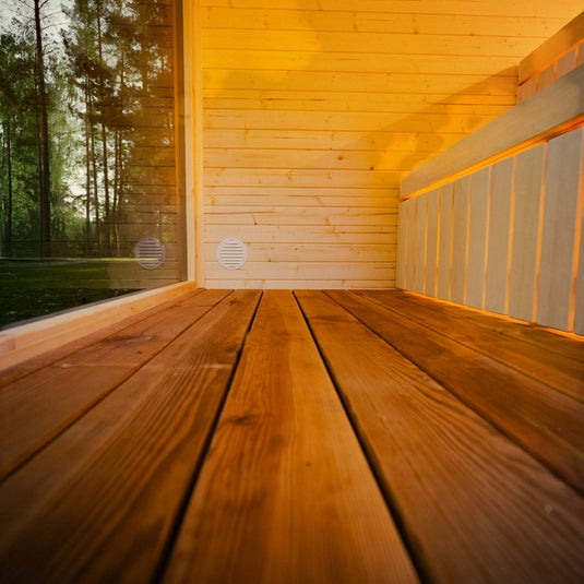 Etna 4-6 person sauna interior with wood benches, floor details and glass front view