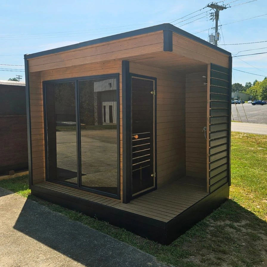 Lux Fjord outdoor sauna angled view showing wood cabin and glass front