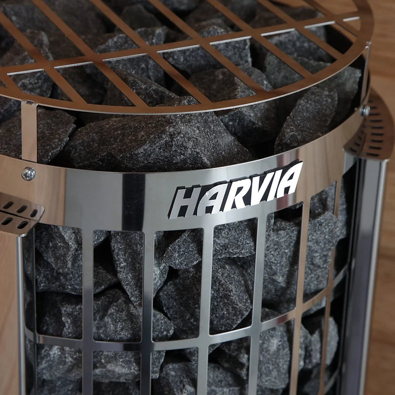 Load image into Gallery viewer, Close-up of Harvia Cilindro 11kW sauna stones inside stainless steel frame with Harvia logo
