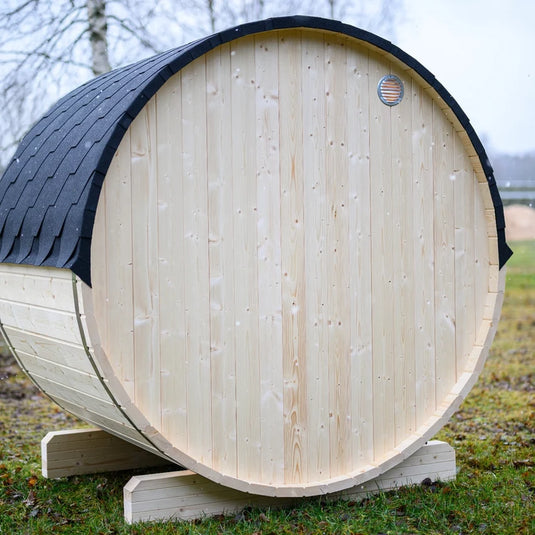 Lumina outdoor sauna side view showing rounded wood body and back vent