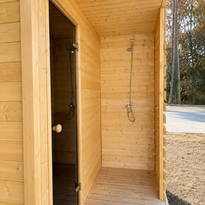 Close-up of Lux Fjord glass door shower and exterior wood cladding