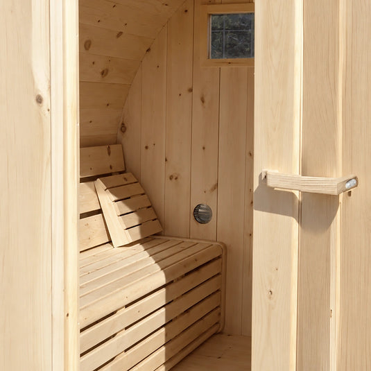 Close-up of flatbarrel sauna door, bench, backrest and window