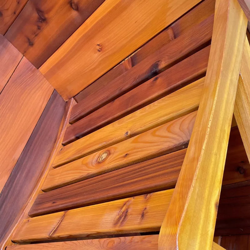 Load image into Gallery viewer, Close-up of 4-person barrel sauna stained bench
