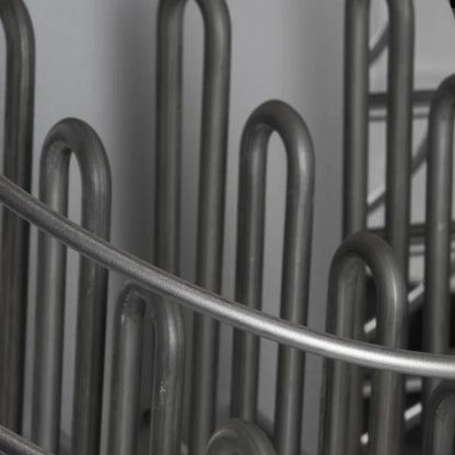 Close-up of HUUM Drop sauna stones in steel mesh frame