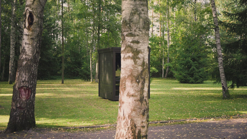 Load and play video in Gallery viewer, Heritage Etna outdoor sauna in a wooded backyard setting
