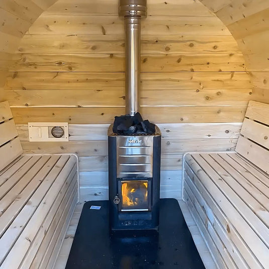 Heritage Sauna® flat barrel sauna interior with facing wood benches and heater